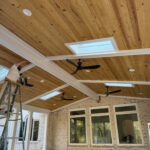 We are putting the finishing touches on the beams with white paint.